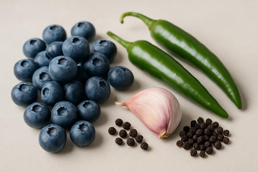 blueberries, serrano peppers, one garlic clove, small pile of black pepper