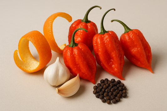 ghost peppers, orange peel, garlic, small pile of black pepper